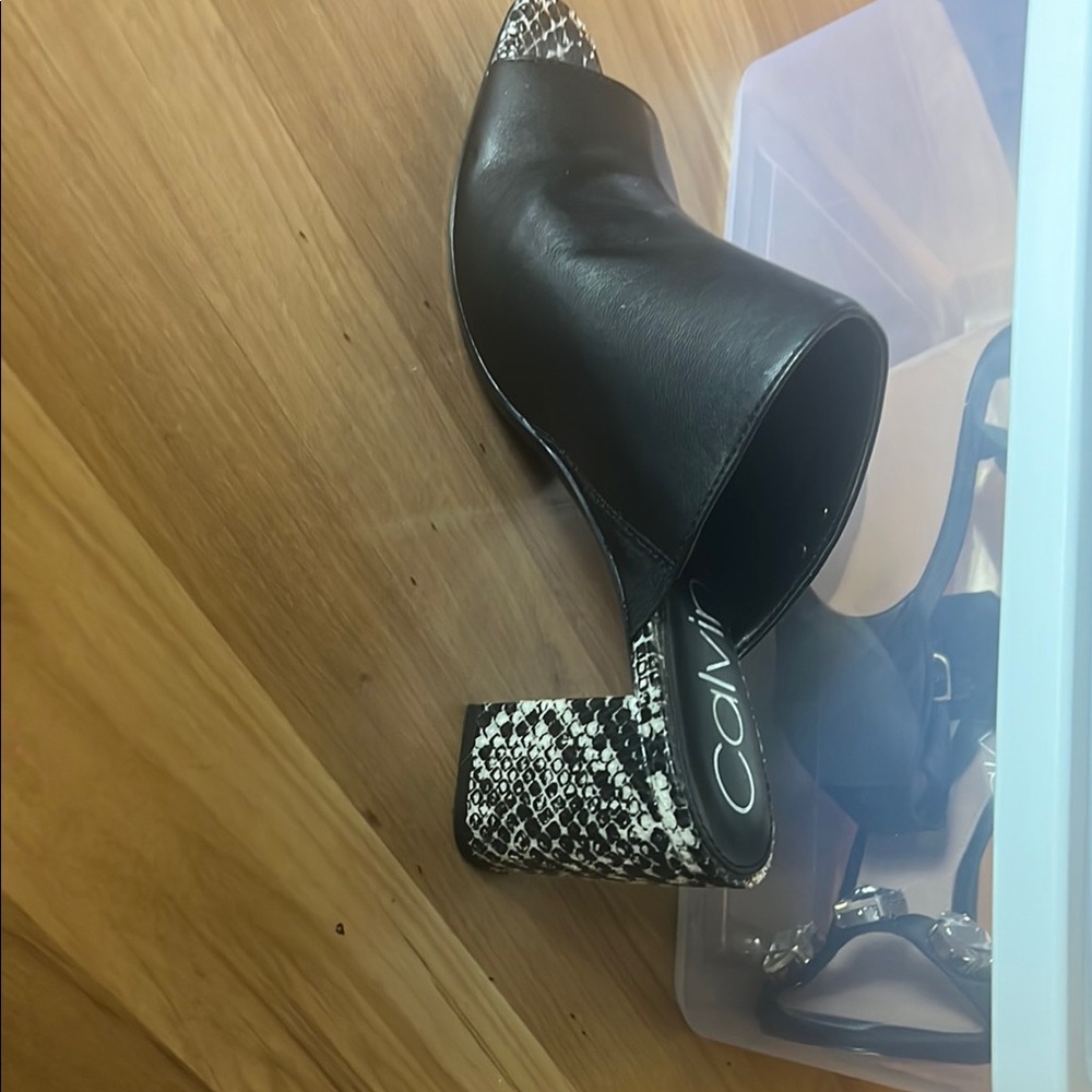 Calvin Klein Black and White Mules with Classic Design